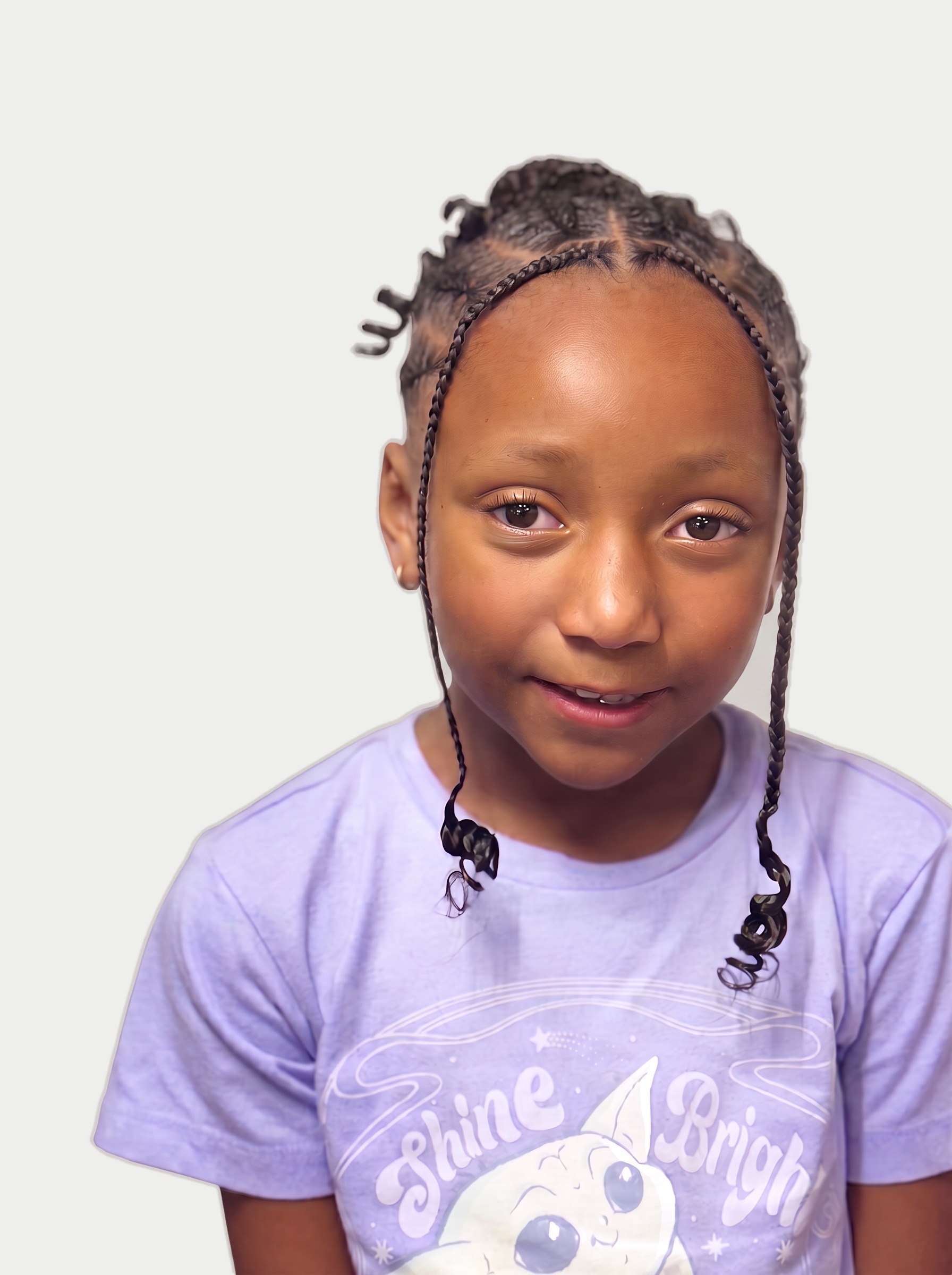 Child with neat braids and curled ends